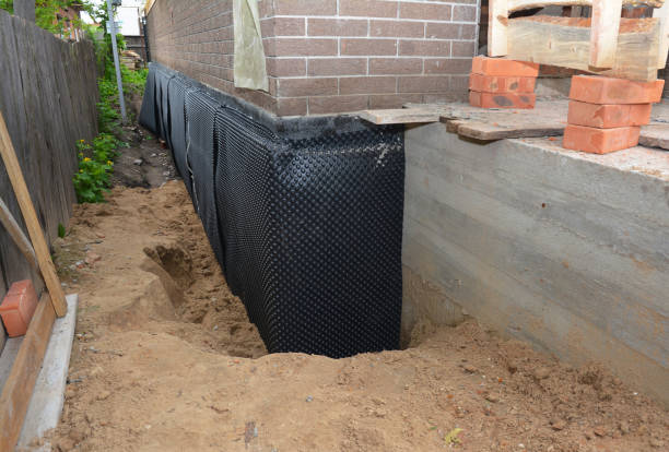 Happy homeowners after waterproofing job in North Wales